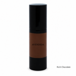 Load image into Gallery viewer, A bottle of AVENDIDA liquid foundation in the shade Rich Chocolate, featuring a deep brown liquid visible through a clear cylindrical bottle with a glossy black cap and base, set against a plain white background.