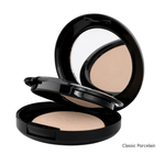 Load image into Gallery viewer, An open round black makeup compact showing a pressed powder in a light warm beige shade, with a mirror visible in the lid. The text 'Classic Porcelain' appears in the bottom right corner on a white background.