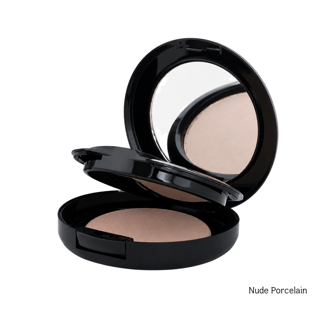 An open black makeup compact showing a pressed powder in a warm light beige shade, with a mirror visible inside the lid. The text 'Nude Porcelain' appears in the bottom right corner on a plain white background.