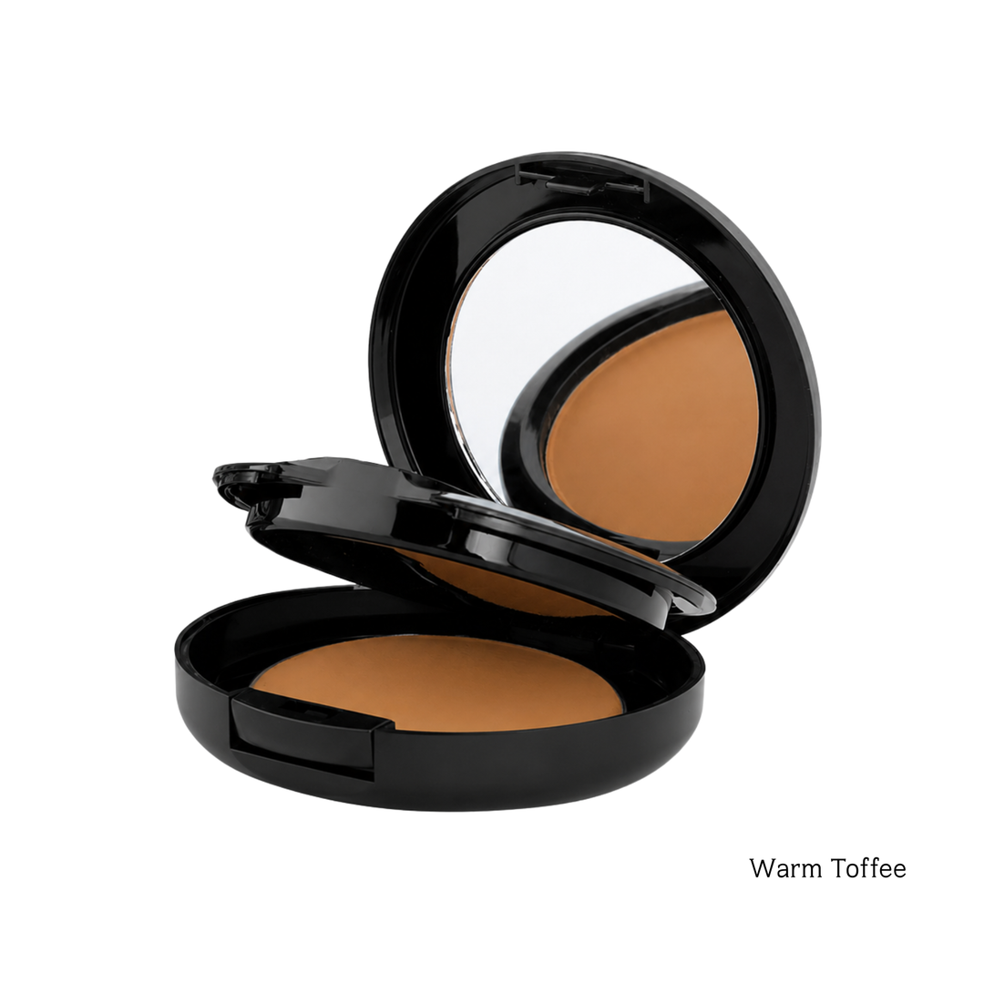 An open black makeup compact showing a warm toffee brown foundation powder, with a mirror in the inner lid, on a white background with the text 'Warm Toffee' in the bottom right corner.