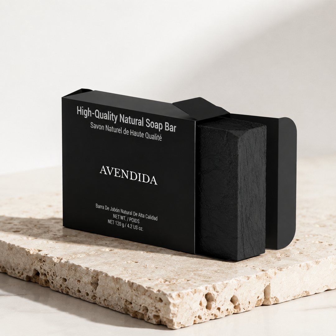 Black soap bar with 'Avendida' branding on a light stone surface.