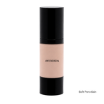 Load image into Gallery viewer, A bottle of AVENDIDA liquid foundation in the shade Soft Porcelain, featuring a light peach-beige liquid visible through a clear bottle with black caps, set against a plain white background.