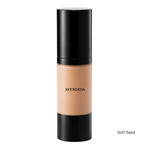 Load image into Gallery viewer, A bottle of Avendida liquid foundation in the shade Soft Sand, featuring a black cap and base with a clear center showing the beige foundation formula, set against a plain white background.