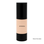 Load image into Gallery viewer, A bottle of Avendida liquid foundation in the shade Warm Porcelain, featuring a black cap and base with a beige foundation shade visible in the center, set against a plain white background.