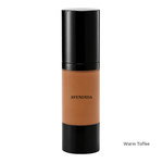 Load image into Gallery viewer, A bottle of Avendida liquid foundation in the shade Warm Toffee, featuring a warm tan-brown color in a clear cylindrical bottle with a glossy black cap and base, set against a plain white background.